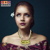God Motif Necklace With White Pearls And Gold Colored Leafs God Motif Necklace With White Pearls And Gold Colored Leafs